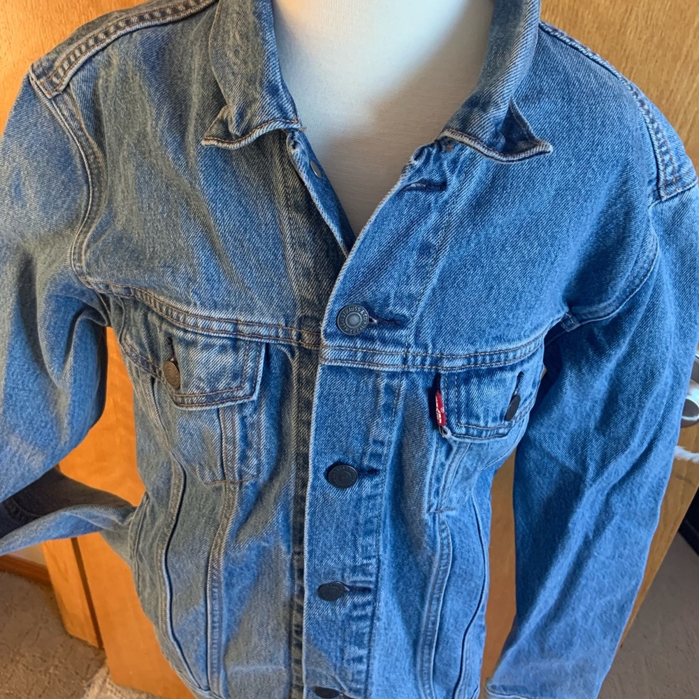 Levi’s Strauss denim jacket with embroidery on the back.